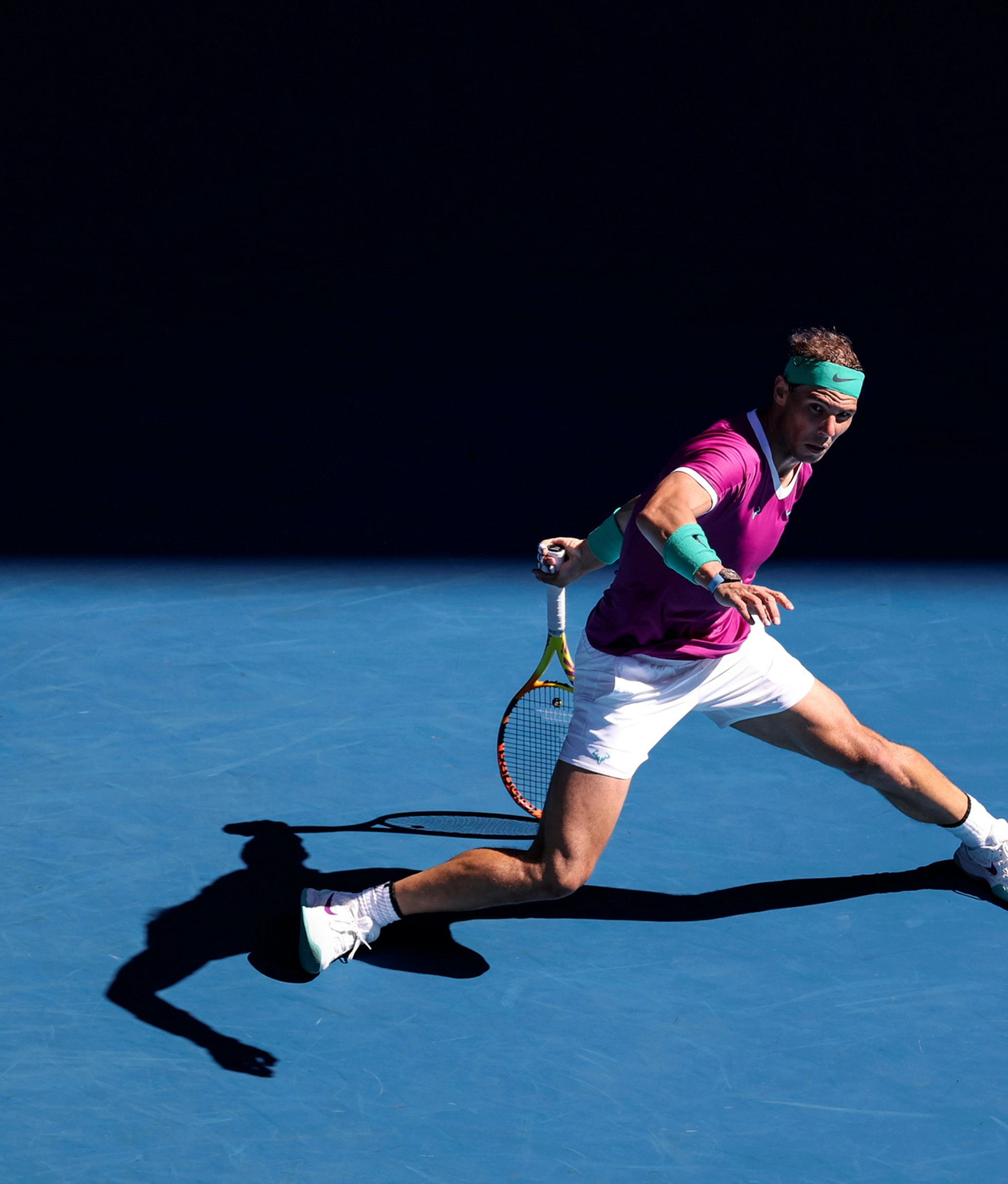 Rafael Nadal swinging his racket.