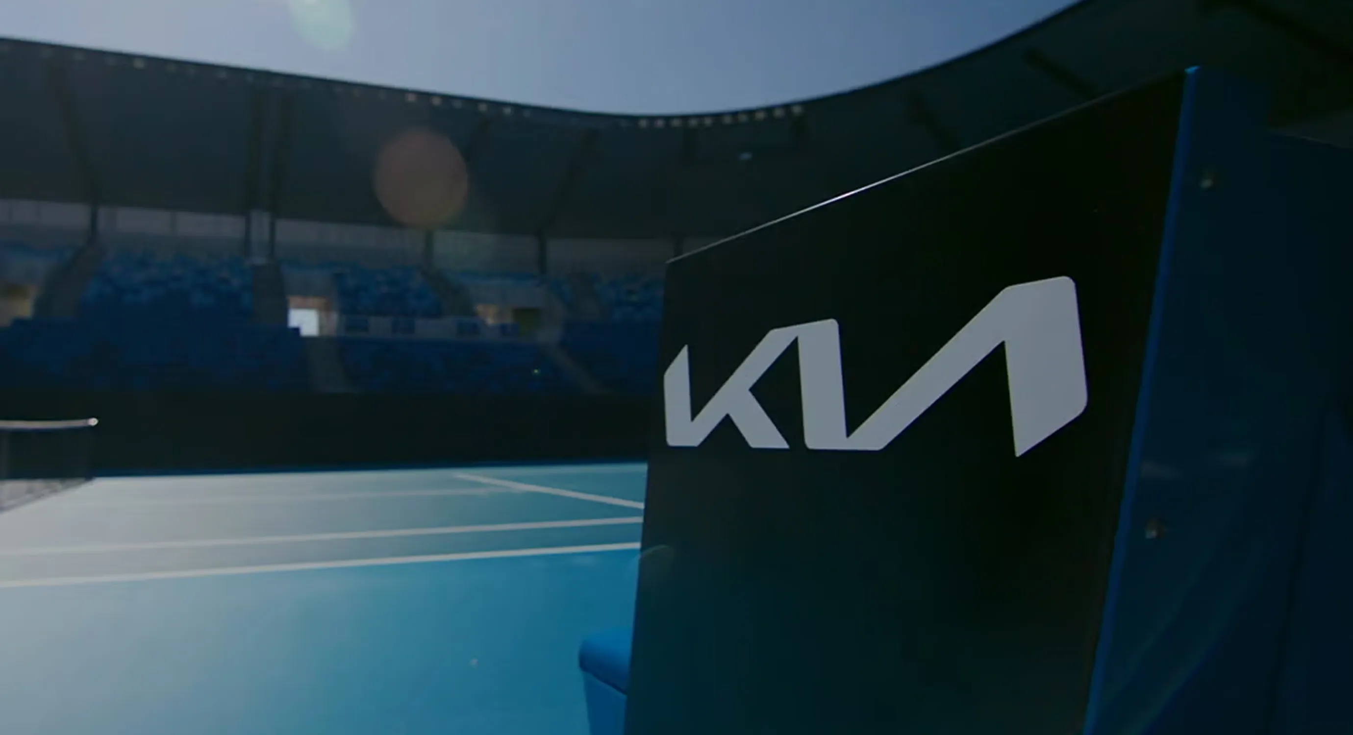 Kia logo signage displayed inside the Australian Open stadium.