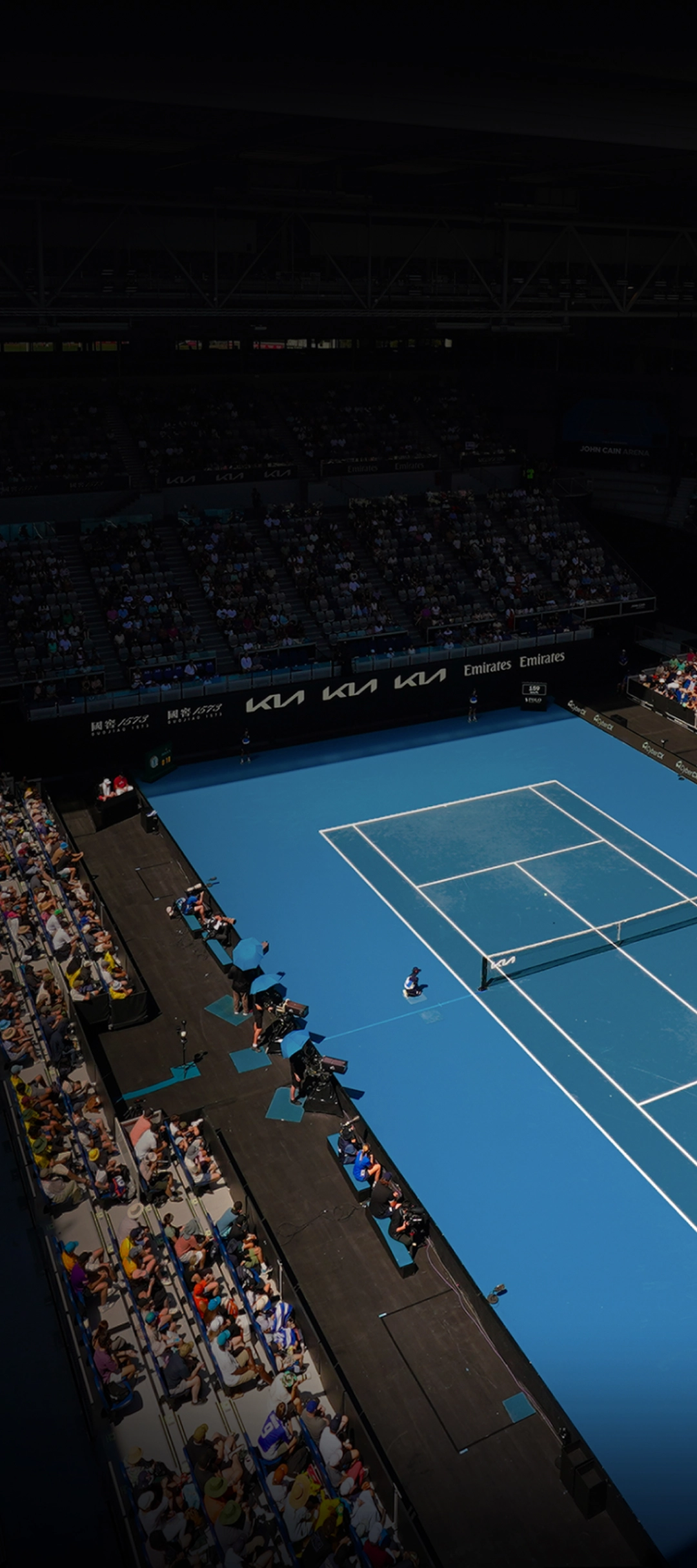 A daytime view of the Australian Open main court under natural light.