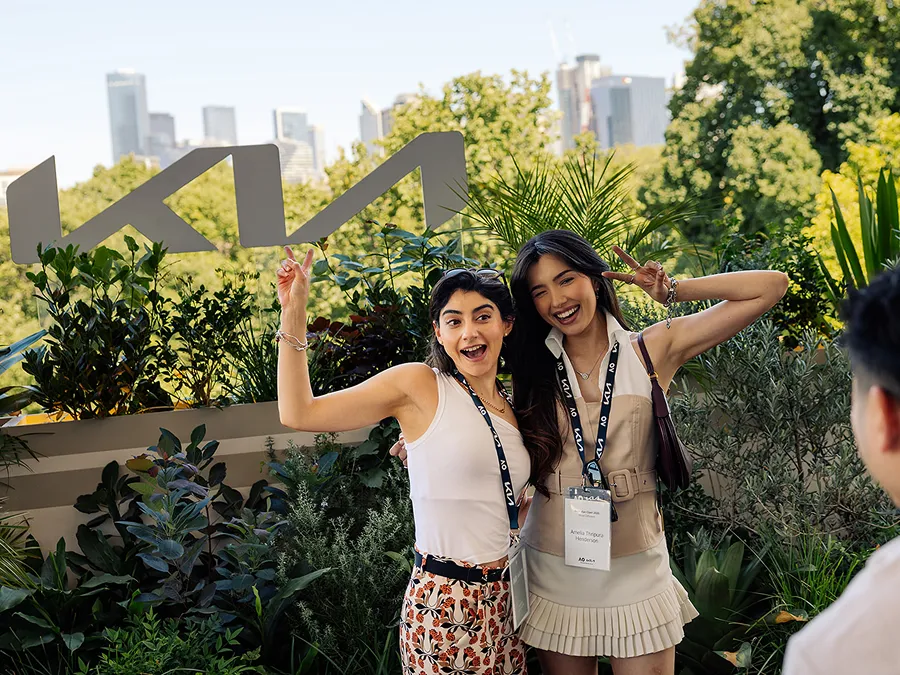 Image of influencers taking photos at a Kia event