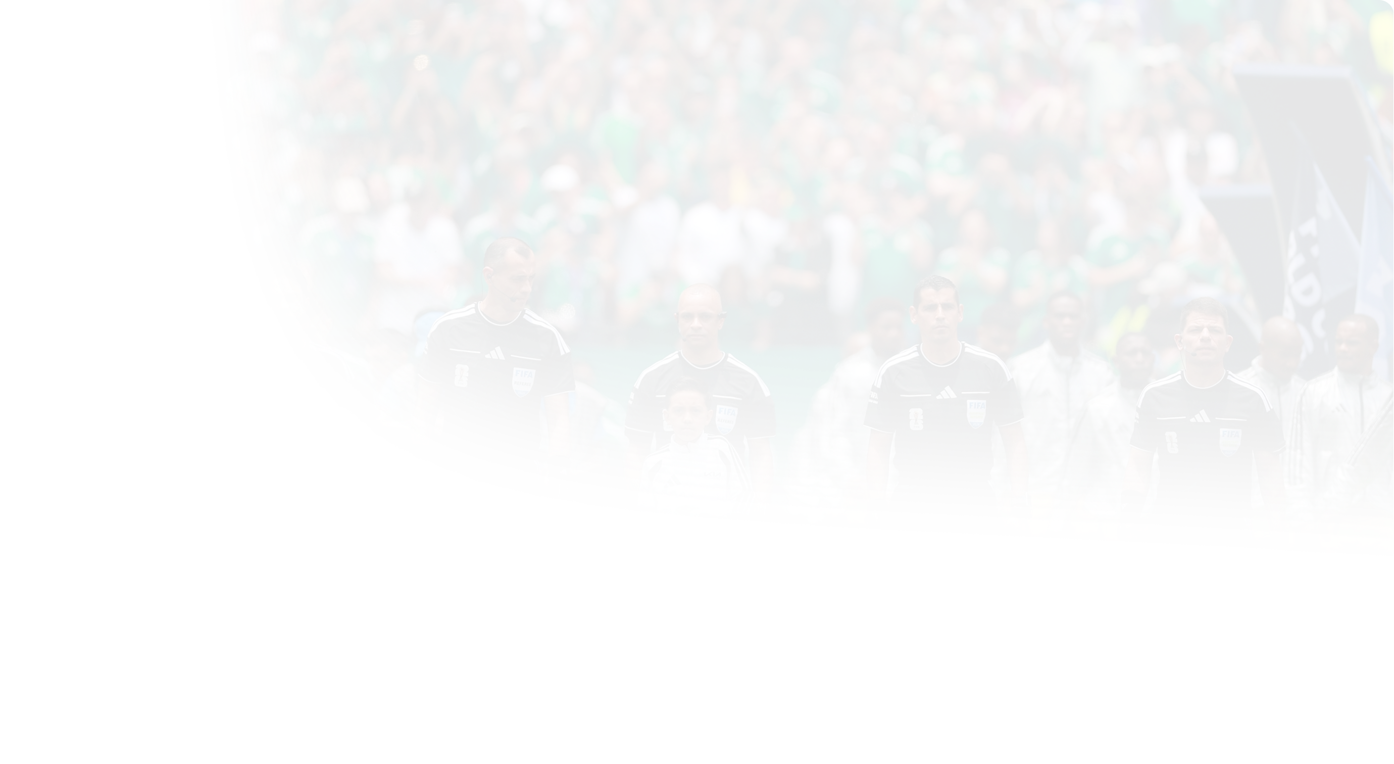 An OMBC participant carrying the official match ball out alongside the match officials in a packed stadium