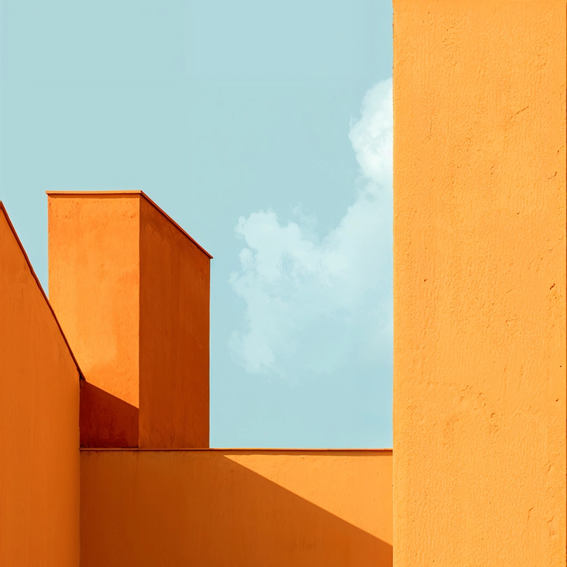 Image of orange architectural structures beneath a blue sky