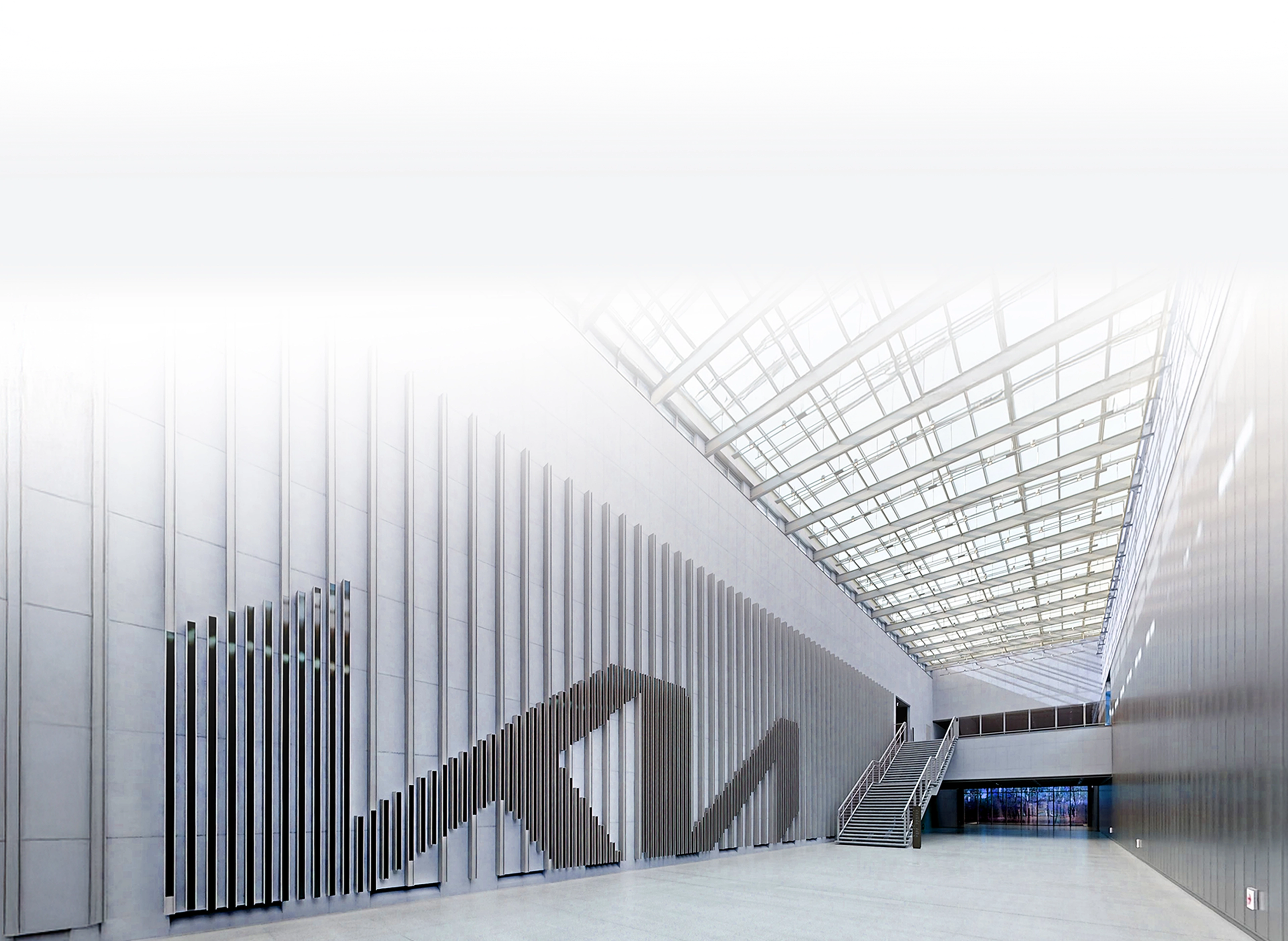 Interior image of the Kia logo wall installation inside the Kia brand experience space Kia360
