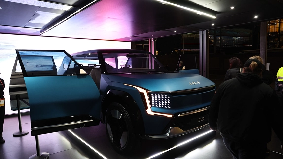 Front view of Kia EV9 displayed in a lit exhibition space