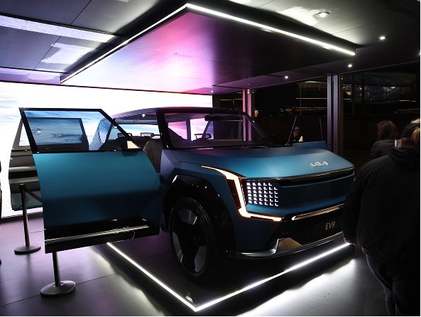 Front view of Kia EV9 displayed in a lit exhibition space