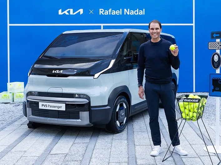 Rafael Nadal posing in front of a Kia PBV vehicle during his visit to Korea