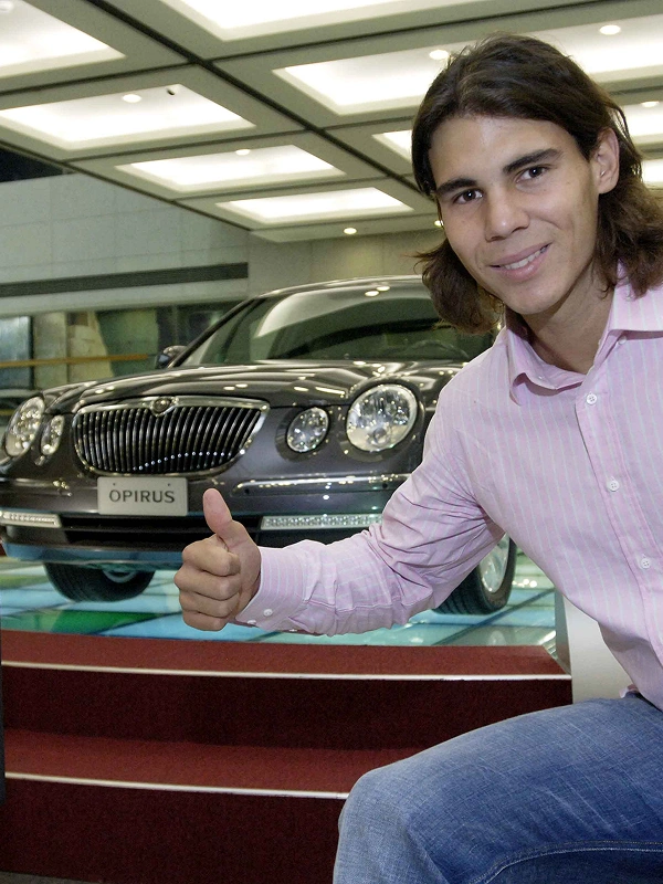 Rafael Nadal introducing a Kia vehicle at an exhibition space