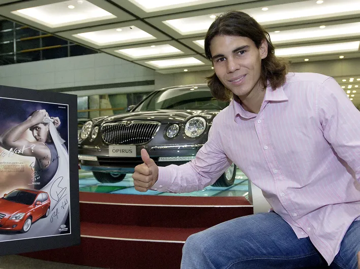 Rafael Nadal introducing a Kia vehicle at an exhibition space