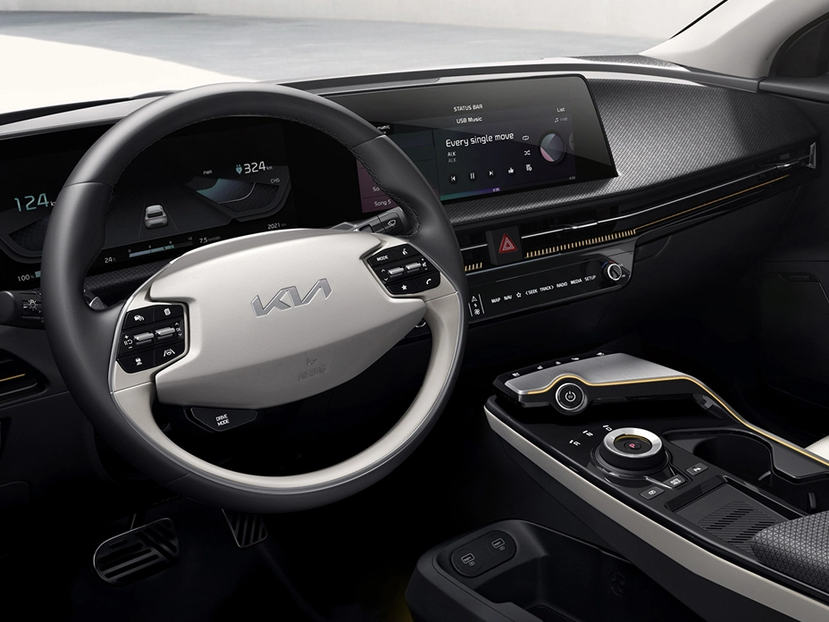Interior view of the Kia EV6 highlighting the panoramic display and steering wheel