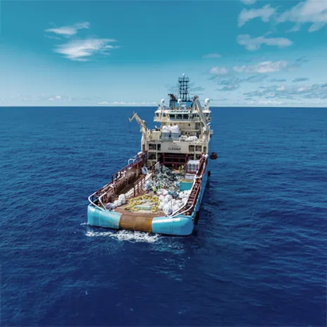 Working vessel sailing on the blue sea