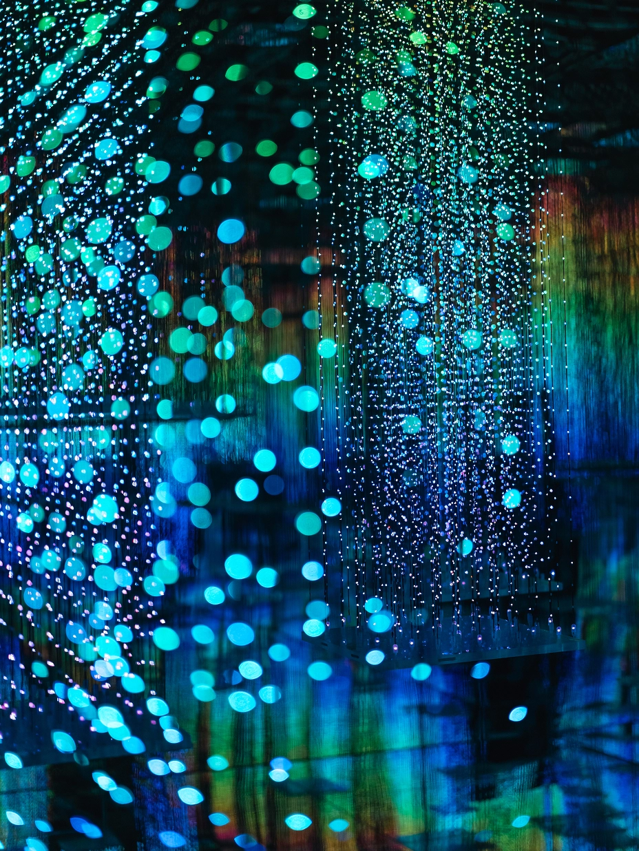 Close-up of blue light spheres and digital grid patterns in LedPulse's 'The DragonO Universe'.