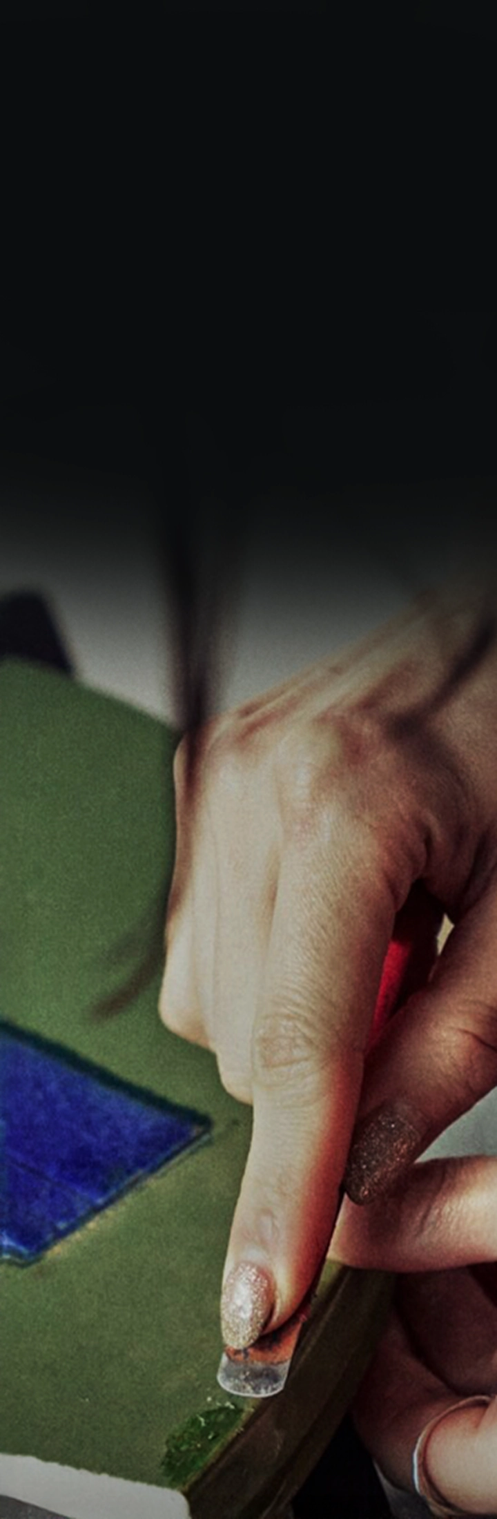 Image of hands processing materials with a crafting tool