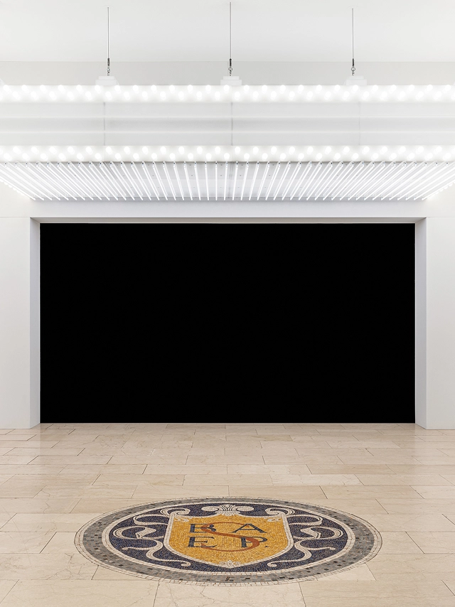 25 exhibition installation with a horizontal lighting structure in 'Eclipse of Perceptions'.