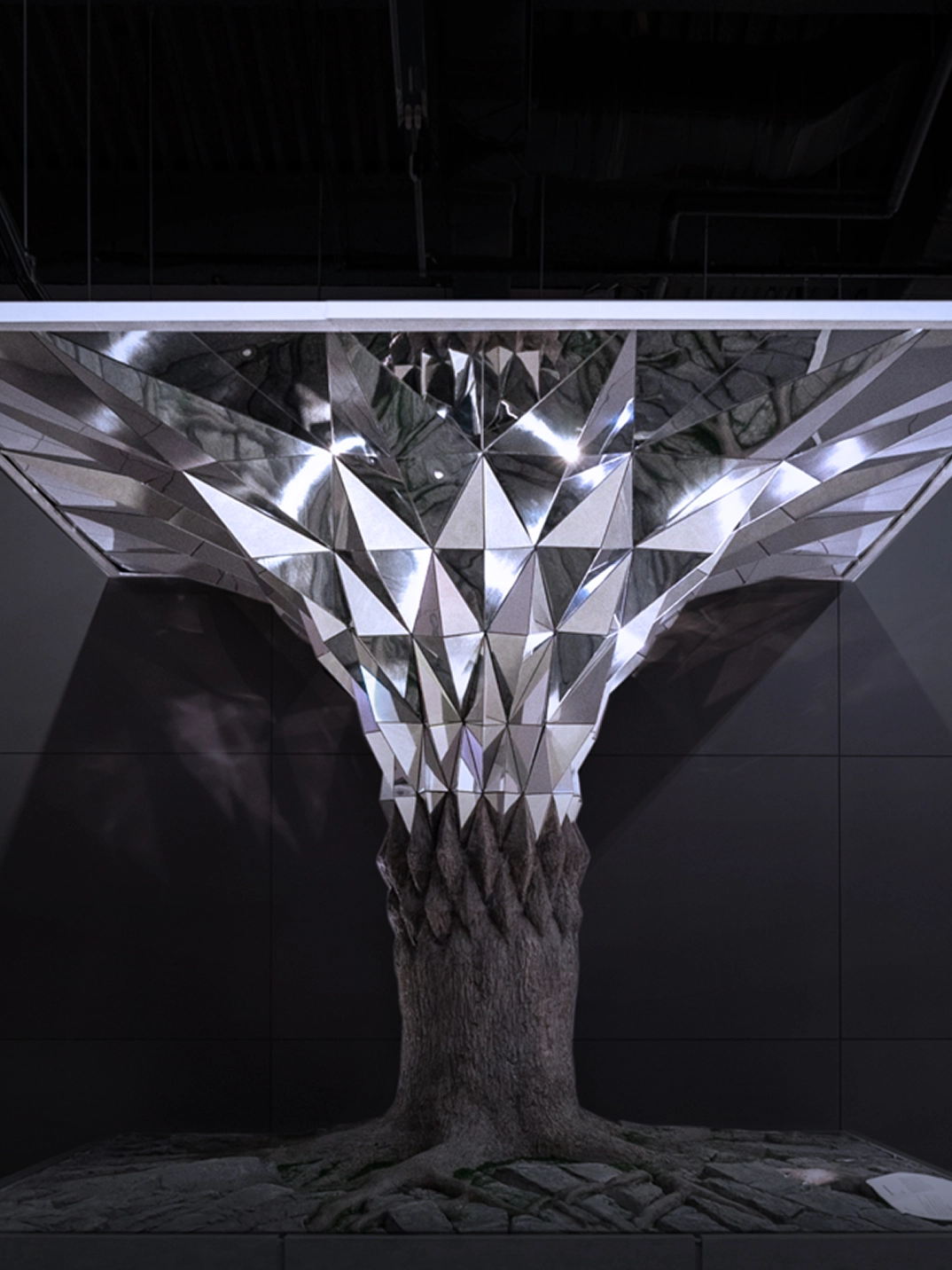 Large installation composed of repeated metallic surfaces at the Busan International Motor Show.