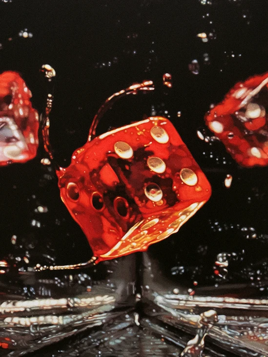 Image of red dice objects splashing above water