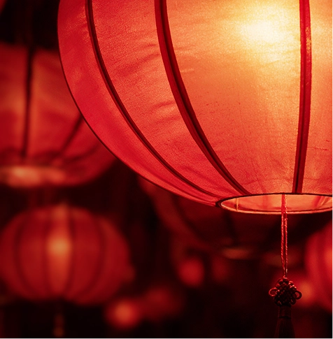 Image of traditional Chinese red lanterns glowing warmly