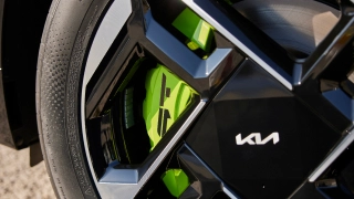 Kia wheel and brake detail image with Kia logo