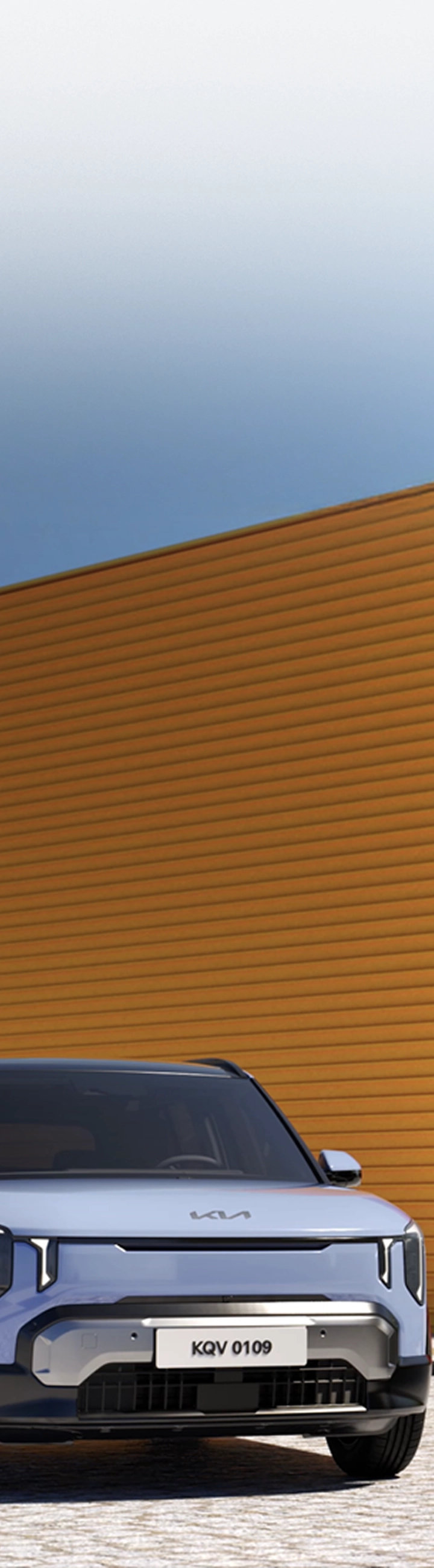 Image of Kia EV2 parked in front of architecture