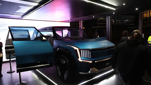 Front view of Kia EV9 displayed in a lit exhibition space