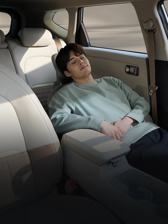 Image of a passenger relaxing inside the vehicle cabin
