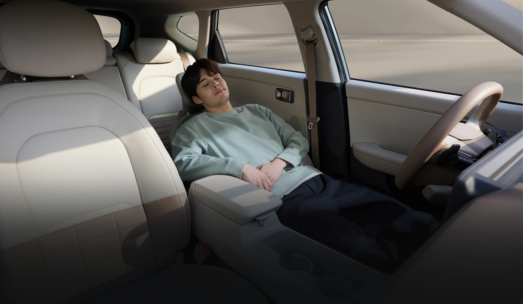 Image of a passenger relaxing inside the vehicle cabin