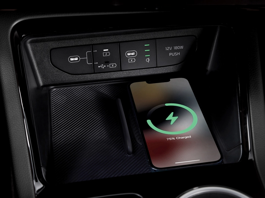 Image of using a wireless charging pad inside a Kia vehicle