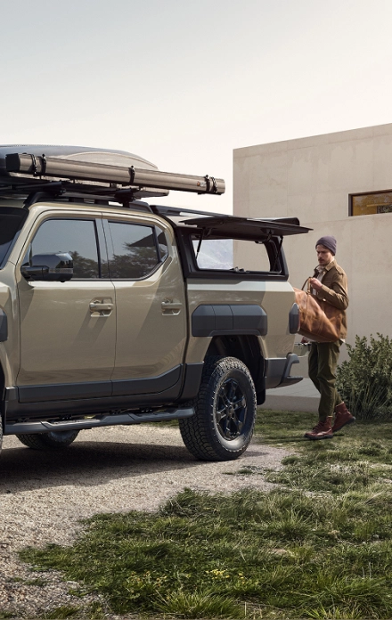 Image of a Kia SUV with camping gear