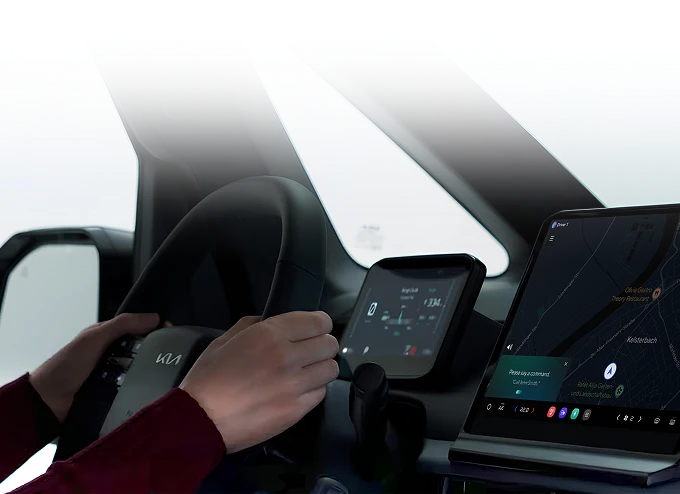 Image showing the use of in-vehicle digital displays and a mobile device