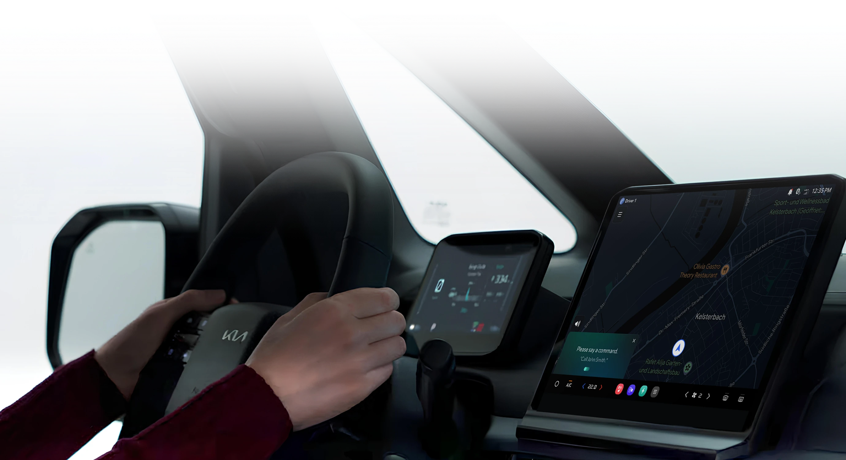 Image showing the use of in-vehicle digital displays and a mobile device