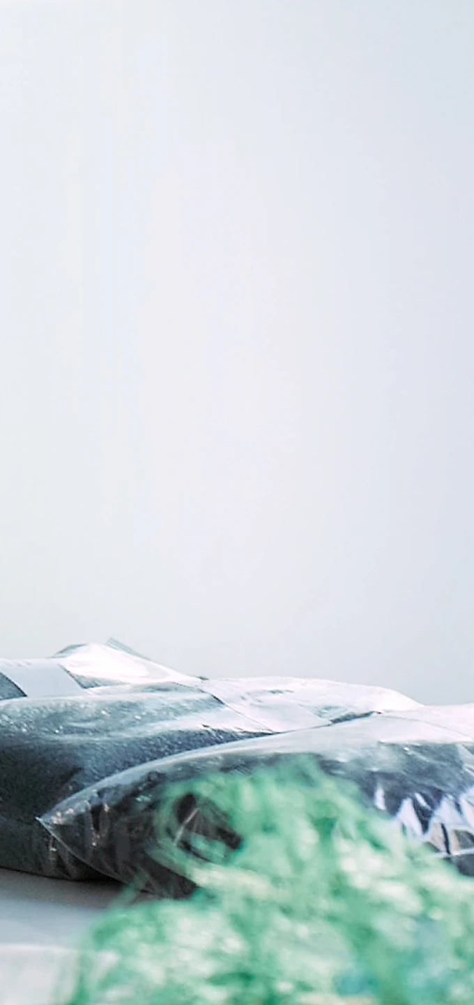 Workspace reviewing plant-based and recycled material samples