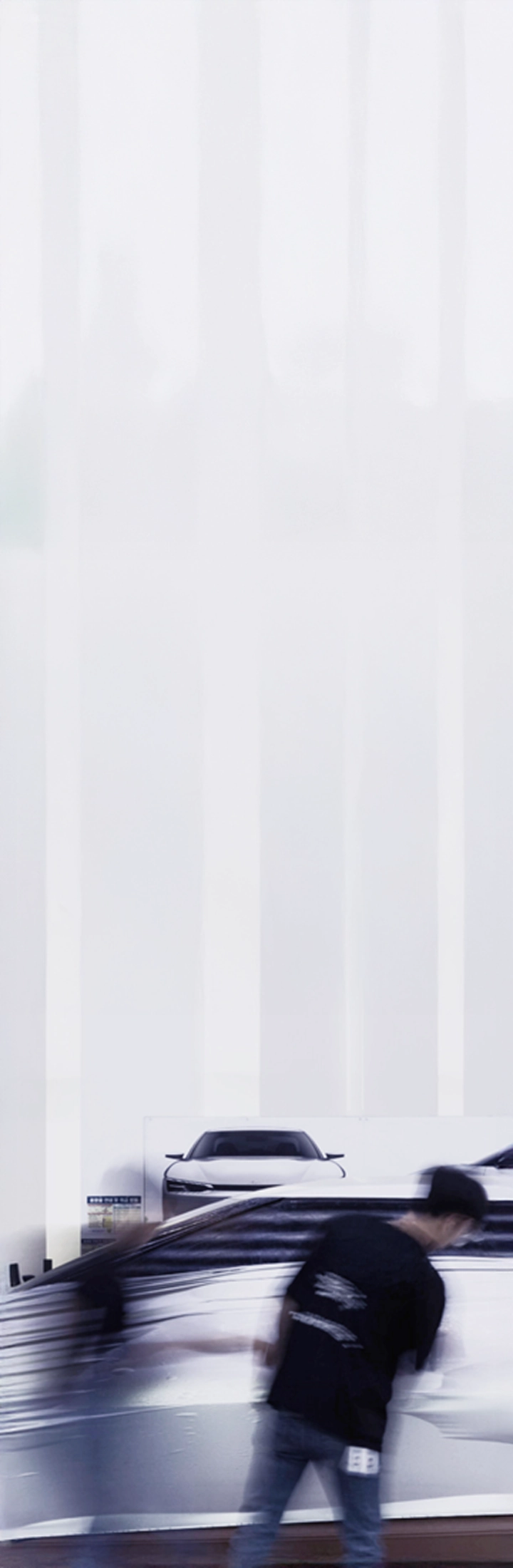 Designer working in front of a clay vehicle model