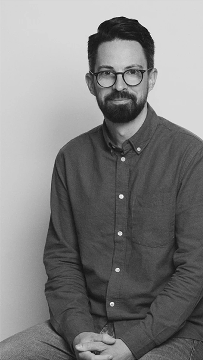 Black-and-white profile portrait of John Buckingham, Head of Kia Next Exterior Design