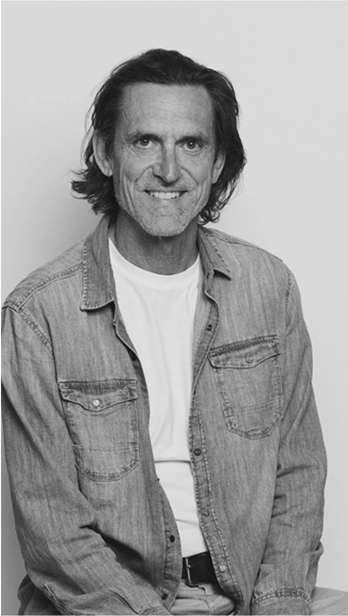 Black-and-white profile portrait of Tom Curran, Senior Designer at Kia America Design Center