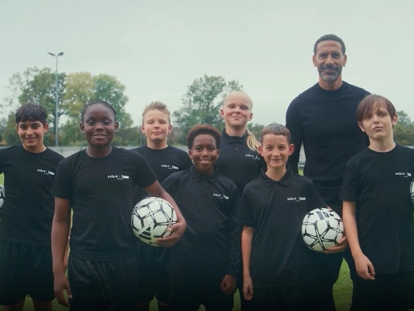 Group image of youth players participating in the FIFA Official Match Ball Carrier program