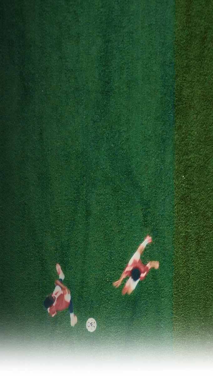 Image of youth players playing a football match on the field