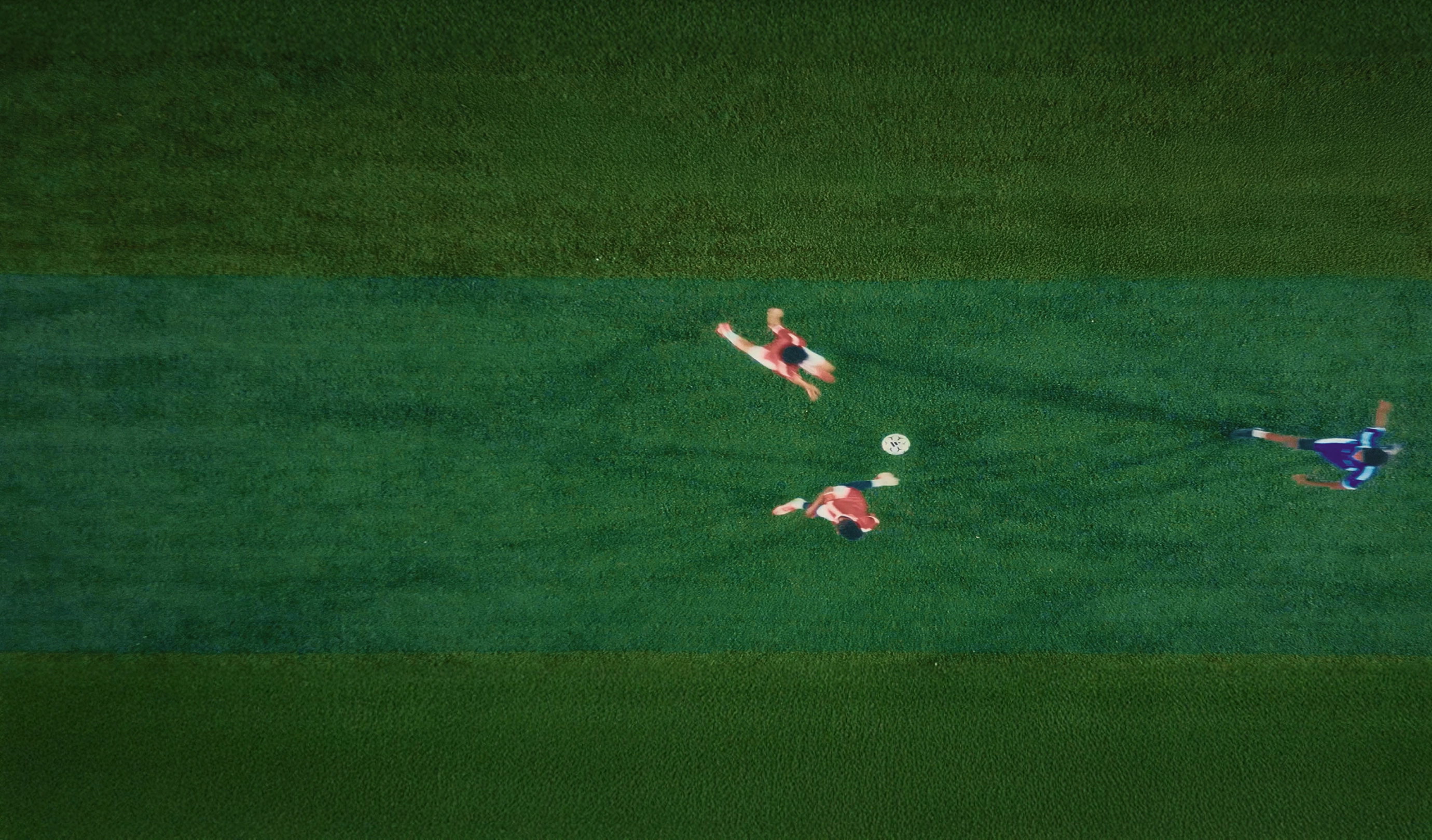 Image of youth players playing a football match on the field