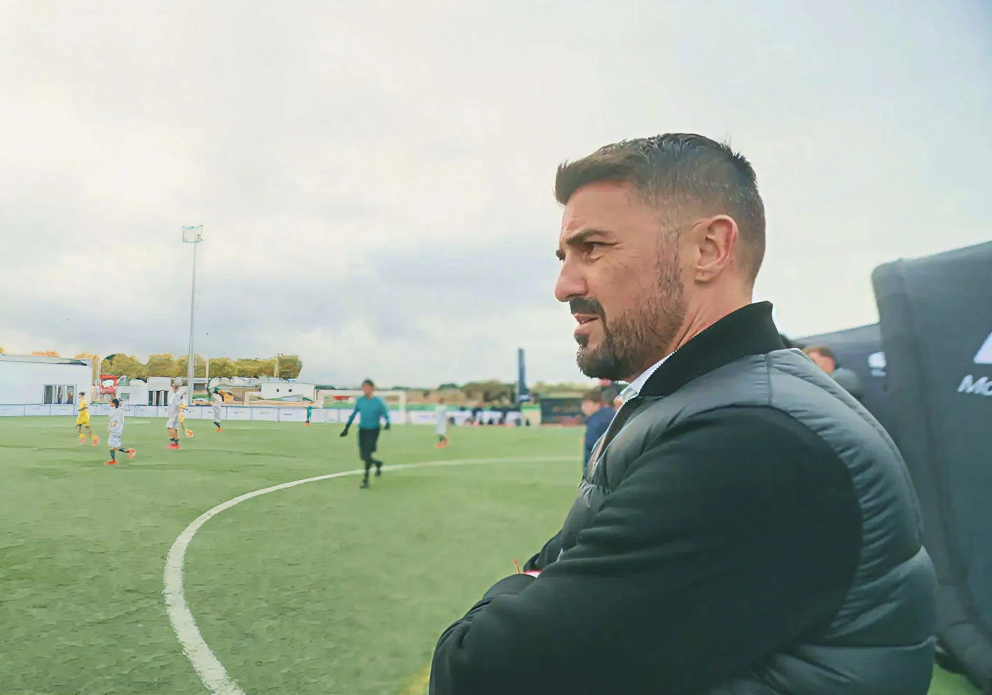 Image of football legend Kaká watching youth players training