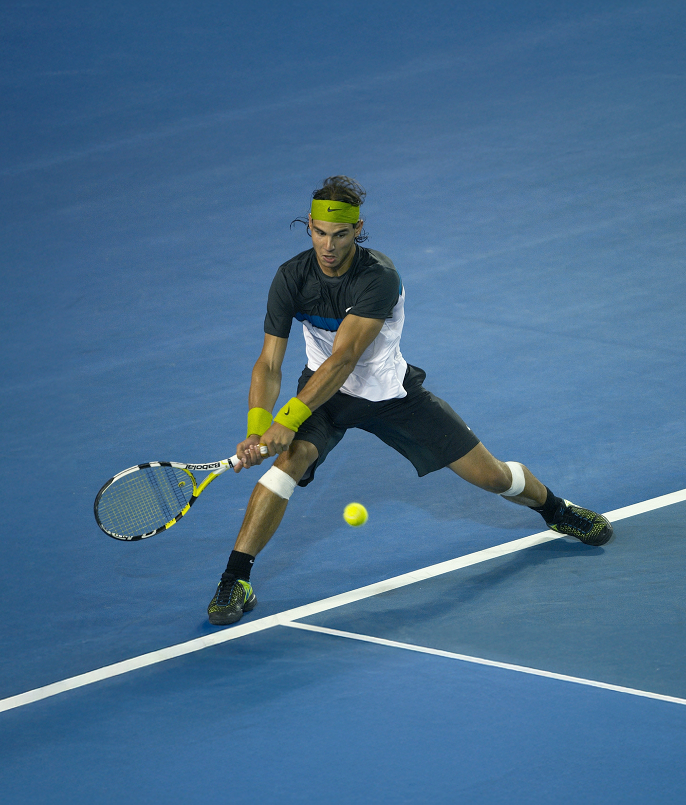 Rafael Nadal returning a shot on the court
