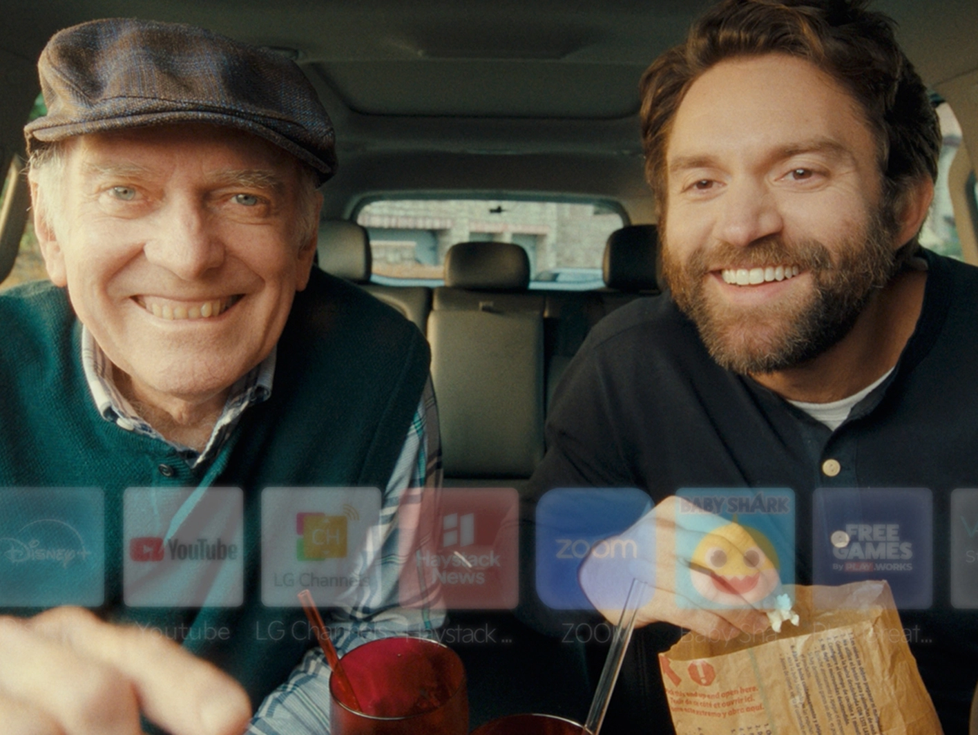 Image of display overlapping with two men using Kia's FoD function