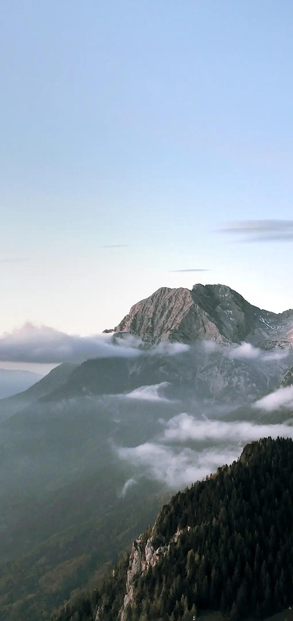 Mountain landscape with clouds and mist