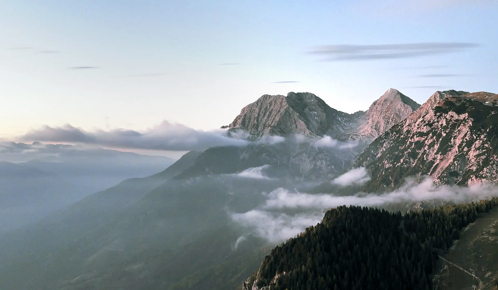 Mountain landscape with clouds and mist