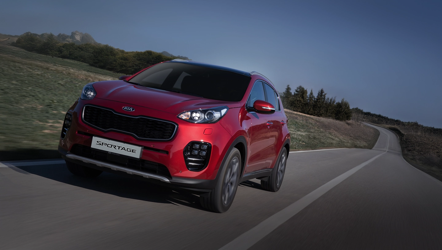 The fourth-generation Kia Sportage driving on a road