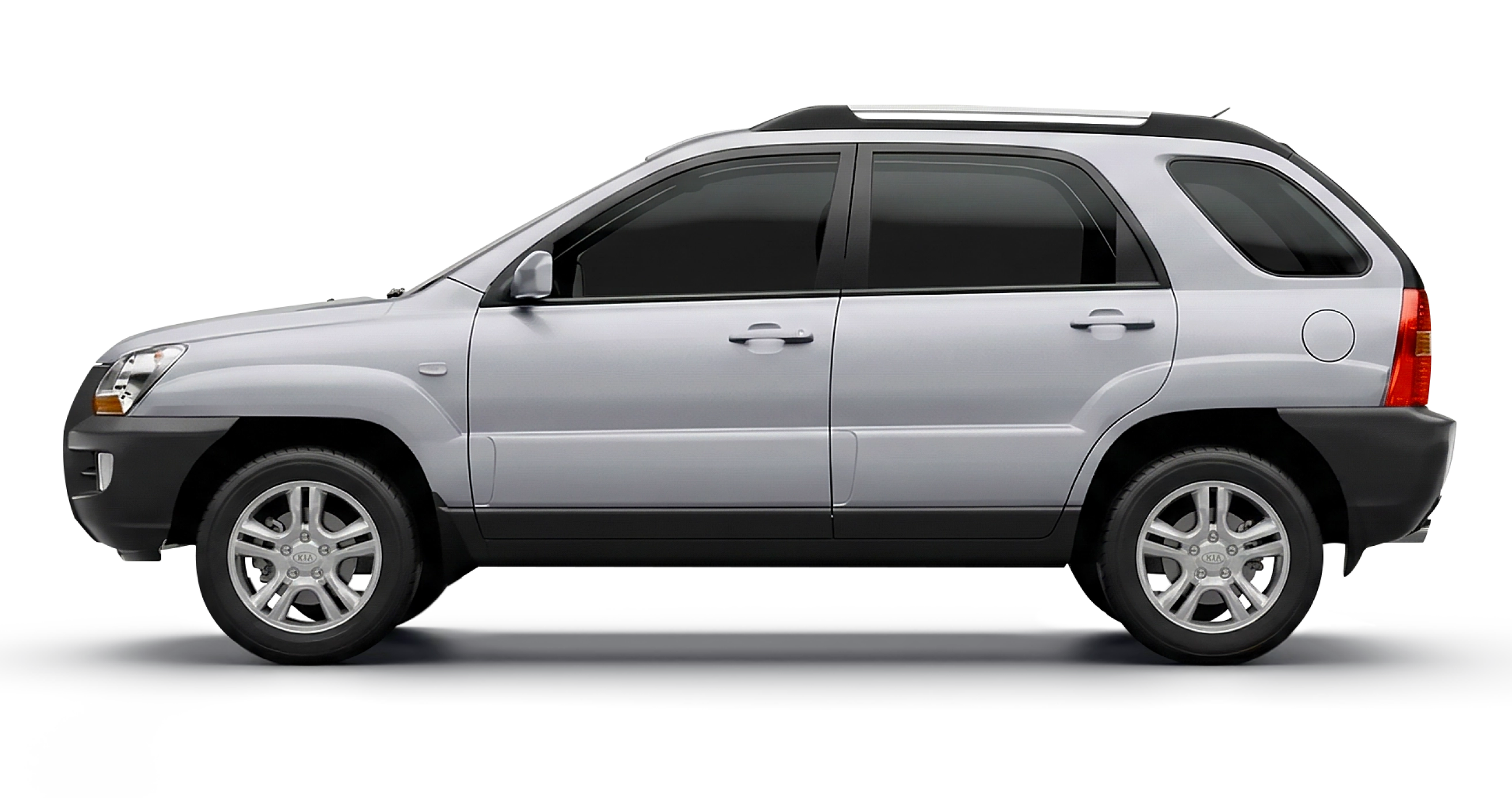 Side exterior view of a white second-generation Kia Sportage