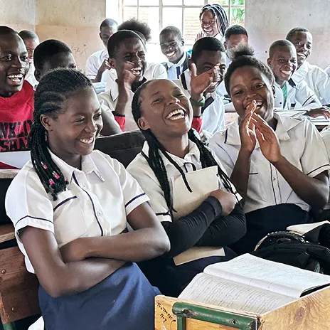 Students in Malawi laughing and participating in a class
