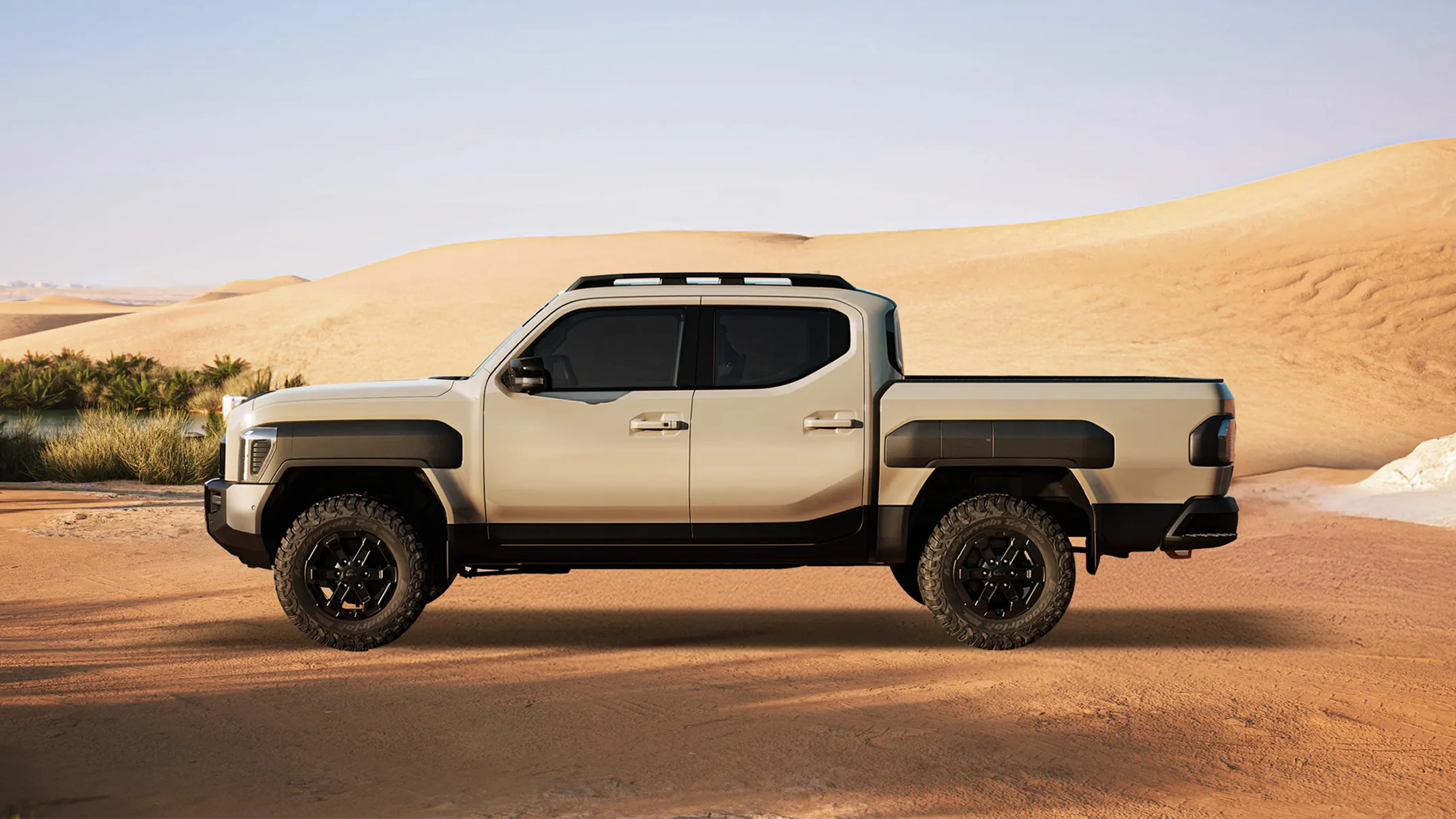 Side view of the Kia Tasman pickup truck parked in a golden desert setting