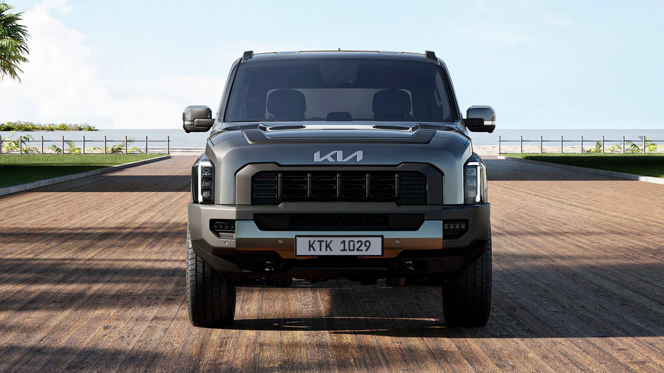 Front view of the Kia Tasman pickup truck set against a desert landscape