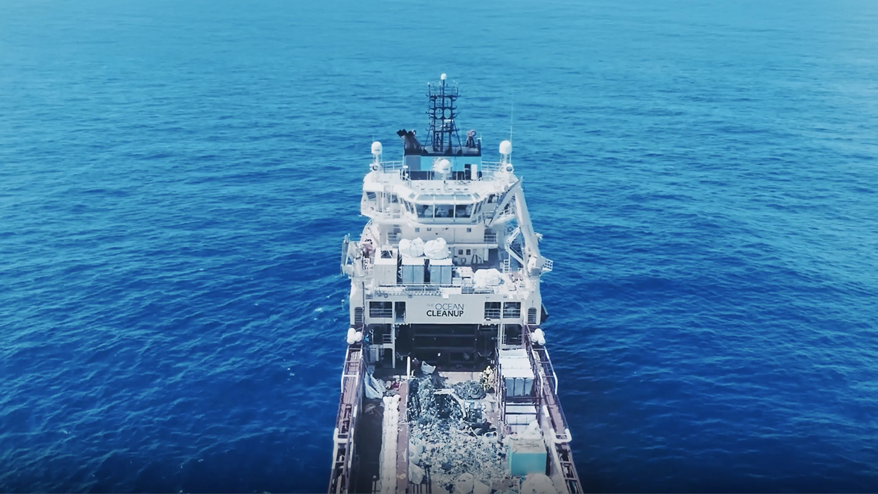 Ocean Cleanup vessel by Kia collecting marine waste at sea