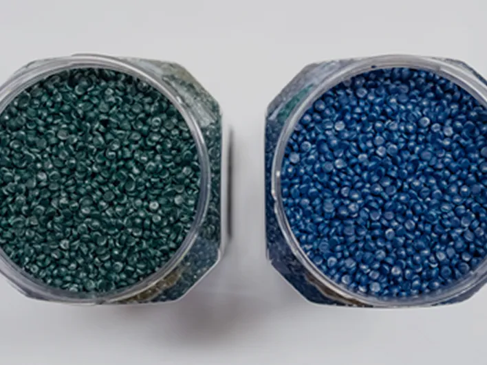 Blue and green plastic pellets sorted for recycling